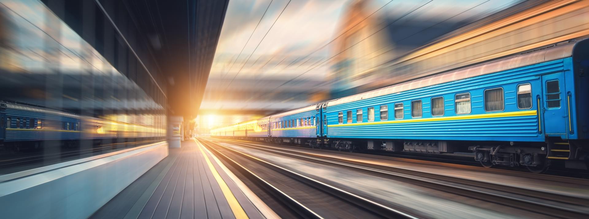 Fast moving blue passenger train