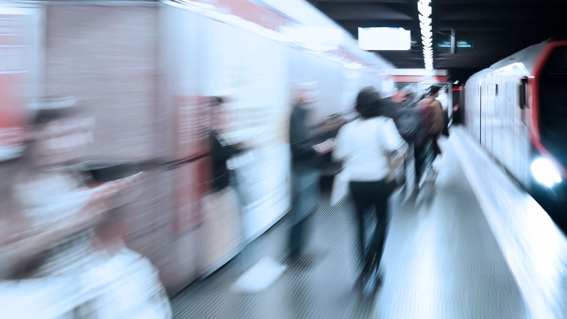 People waiting for the arriving subway at the underground station