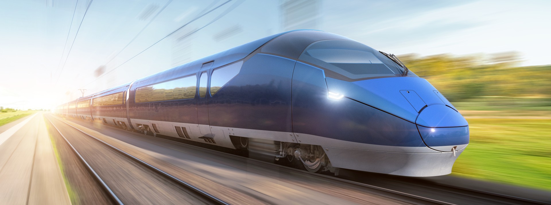 High-speed blue train moving on railway tracks.