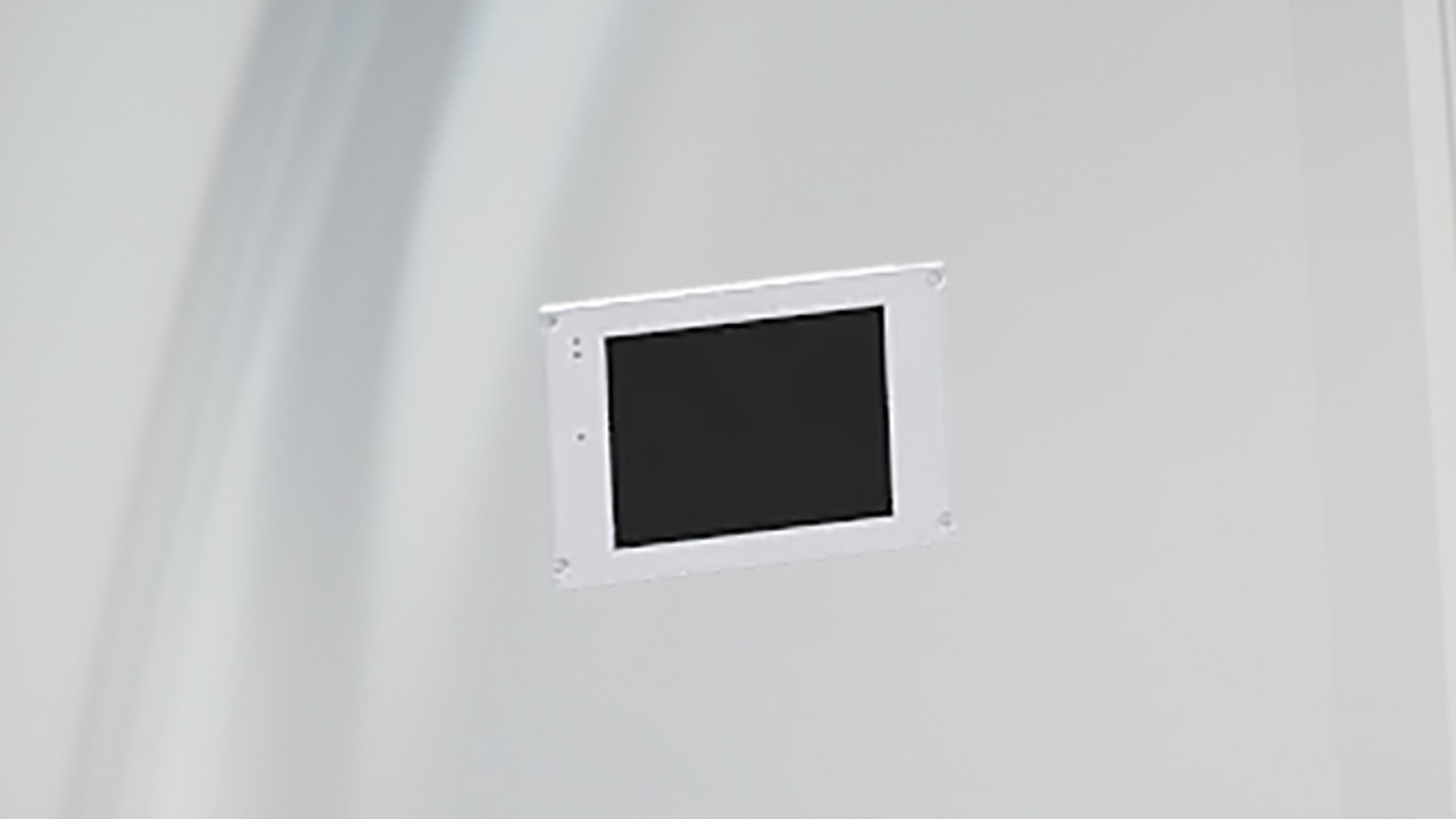 Control panel mounted on a white wall.