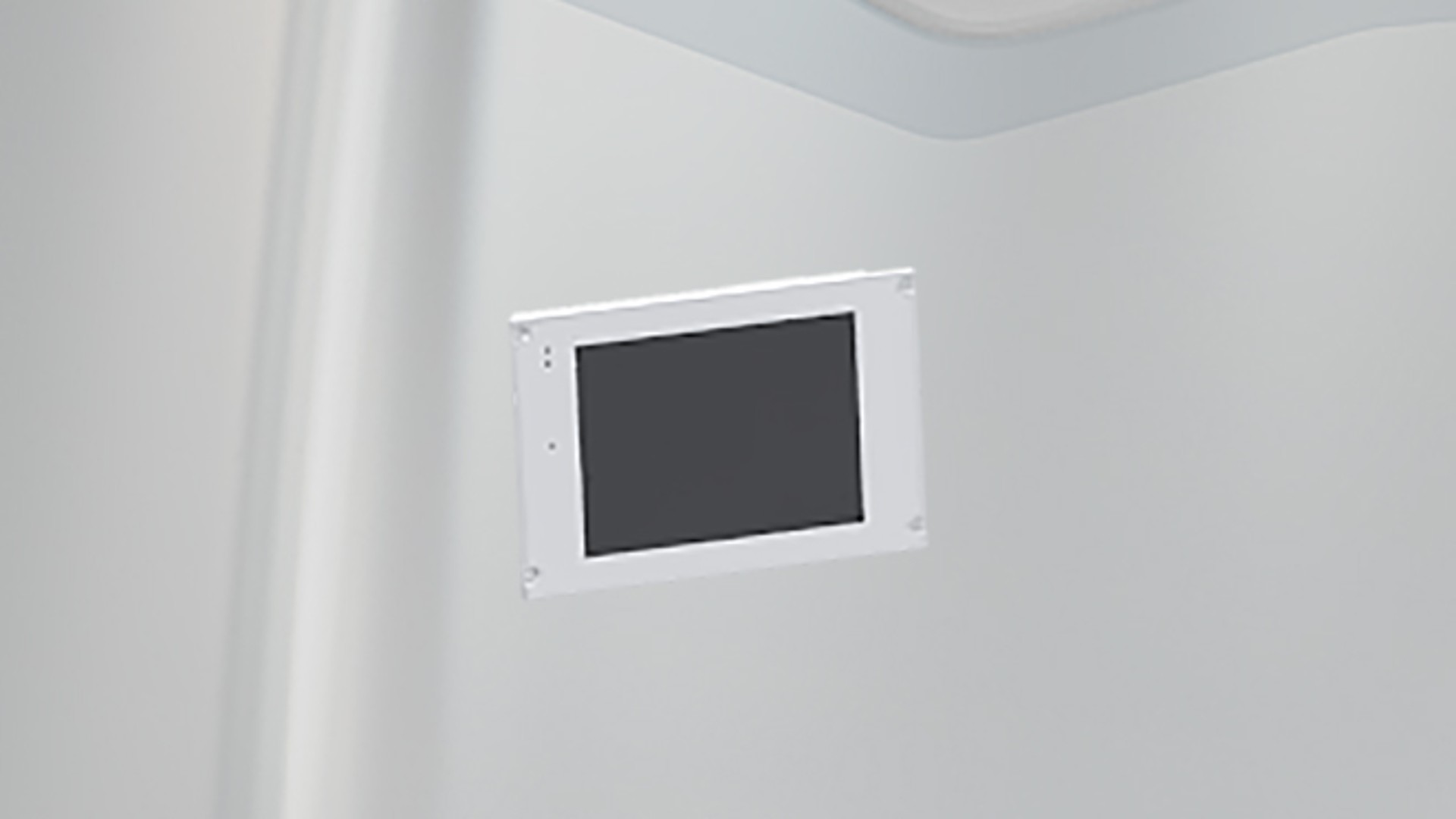Blank mounted display screen on a wall.