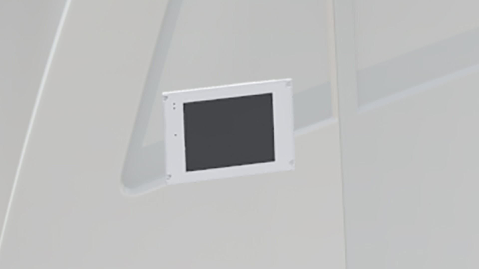 Digital display mounted on a white wall.