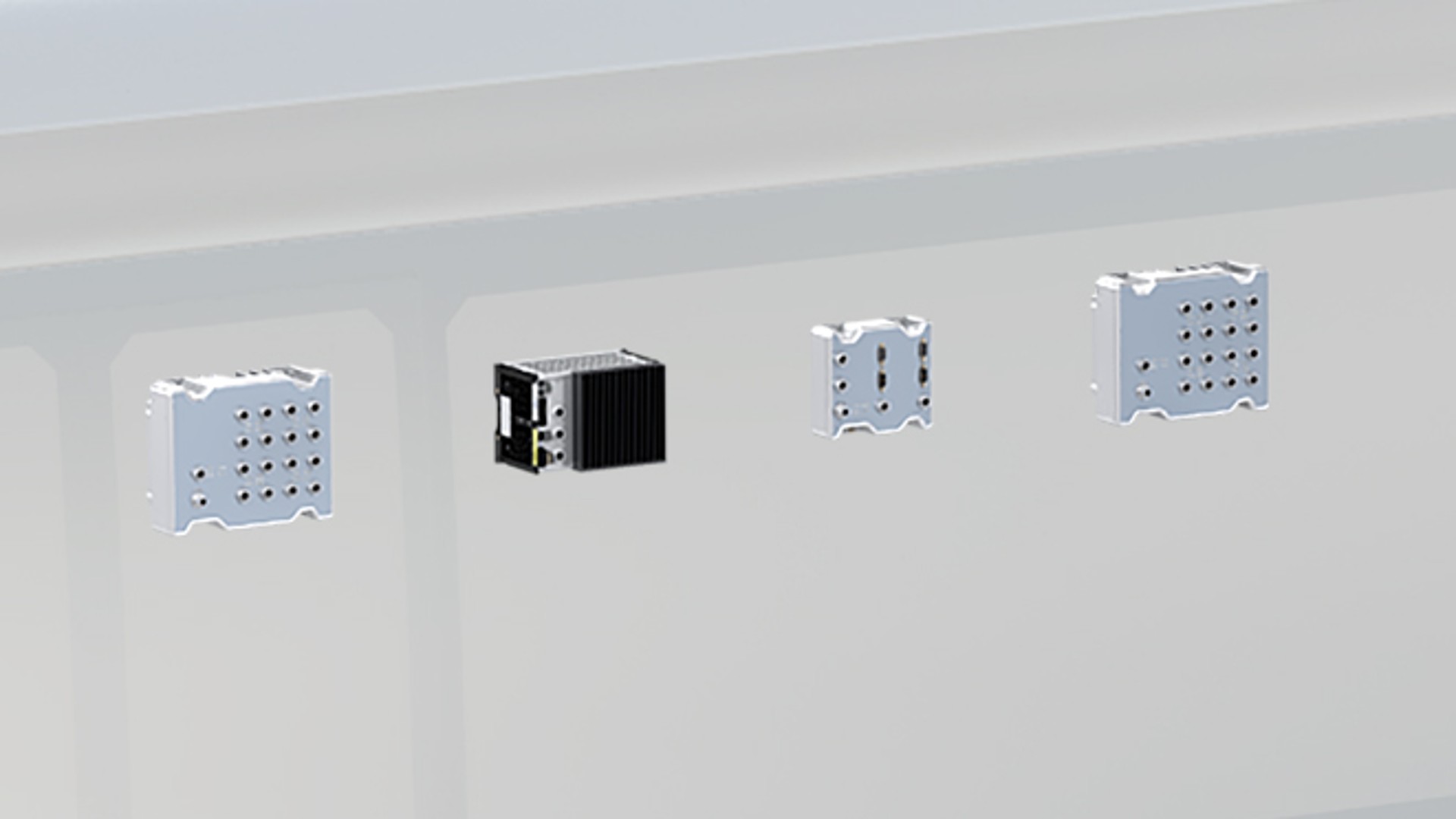 Various industrial connectors on a metallic surface.