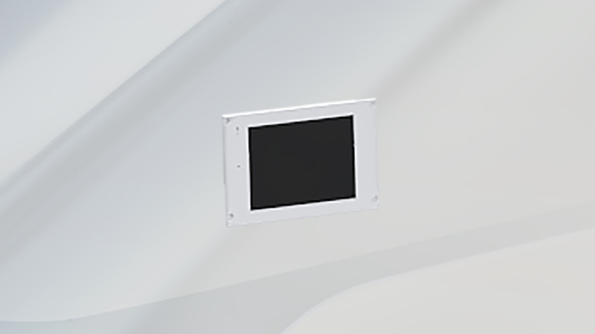 Control panel mounted on a white wall.