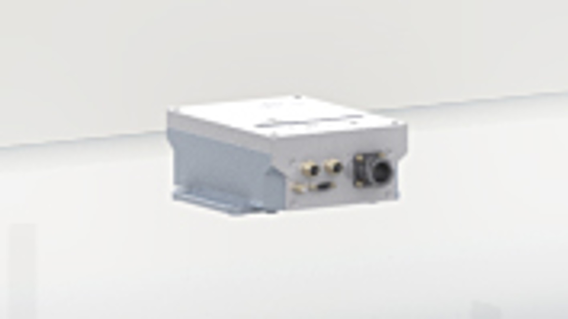 Industrial electronic control unit on white background.