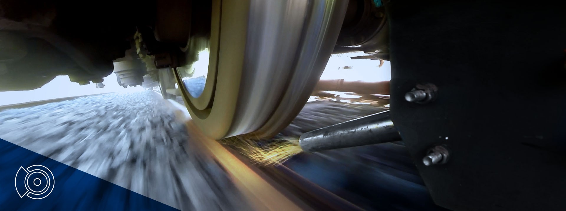 Train wheel in motion on railway track.