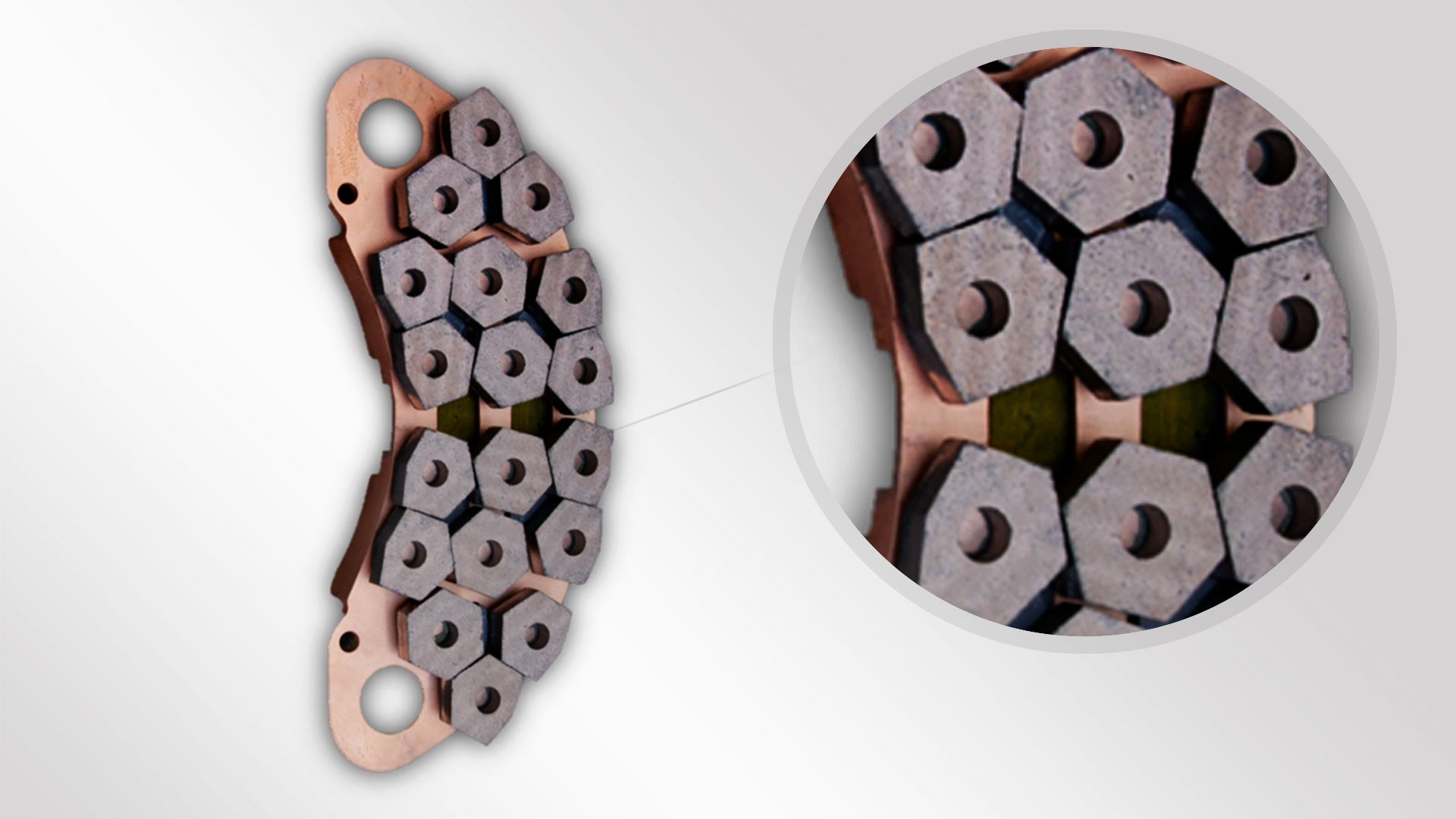 Brake pad cross-section with hexagonal components.