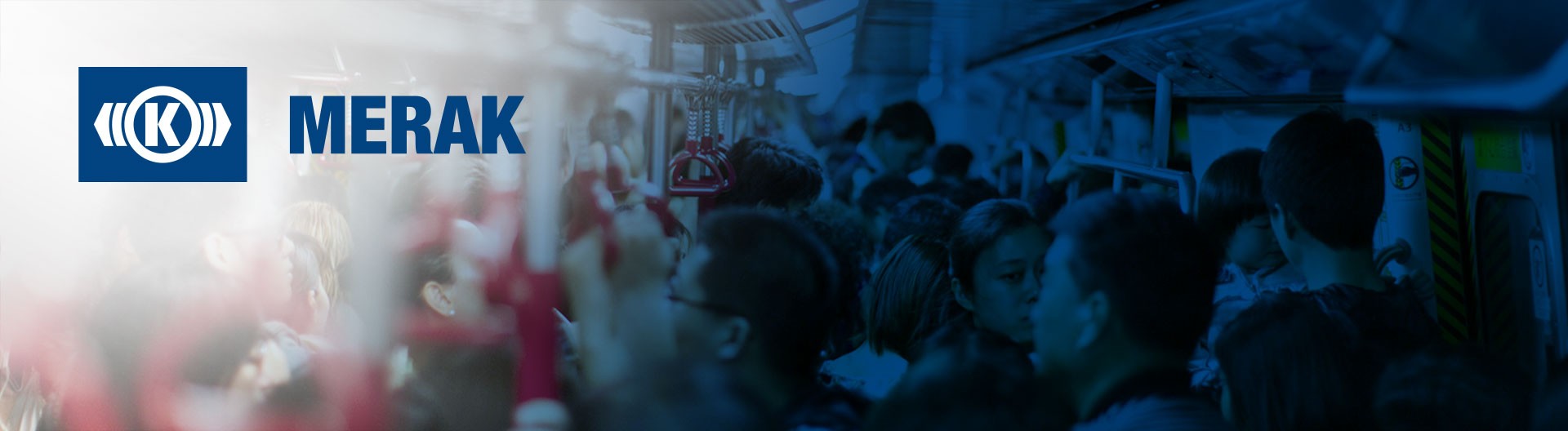 Busy subway interior with commuters and overhead