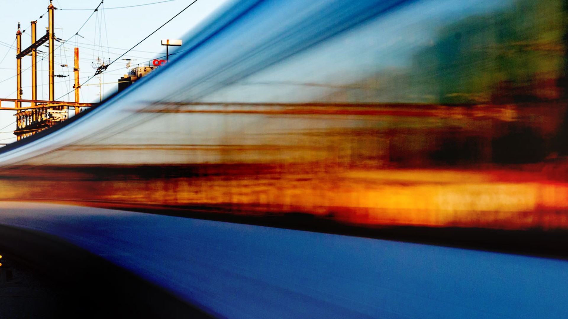 High-speed train passing through railway tracks.