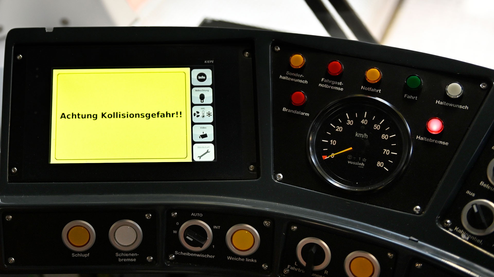 Train control panel displaying collision warning alert.