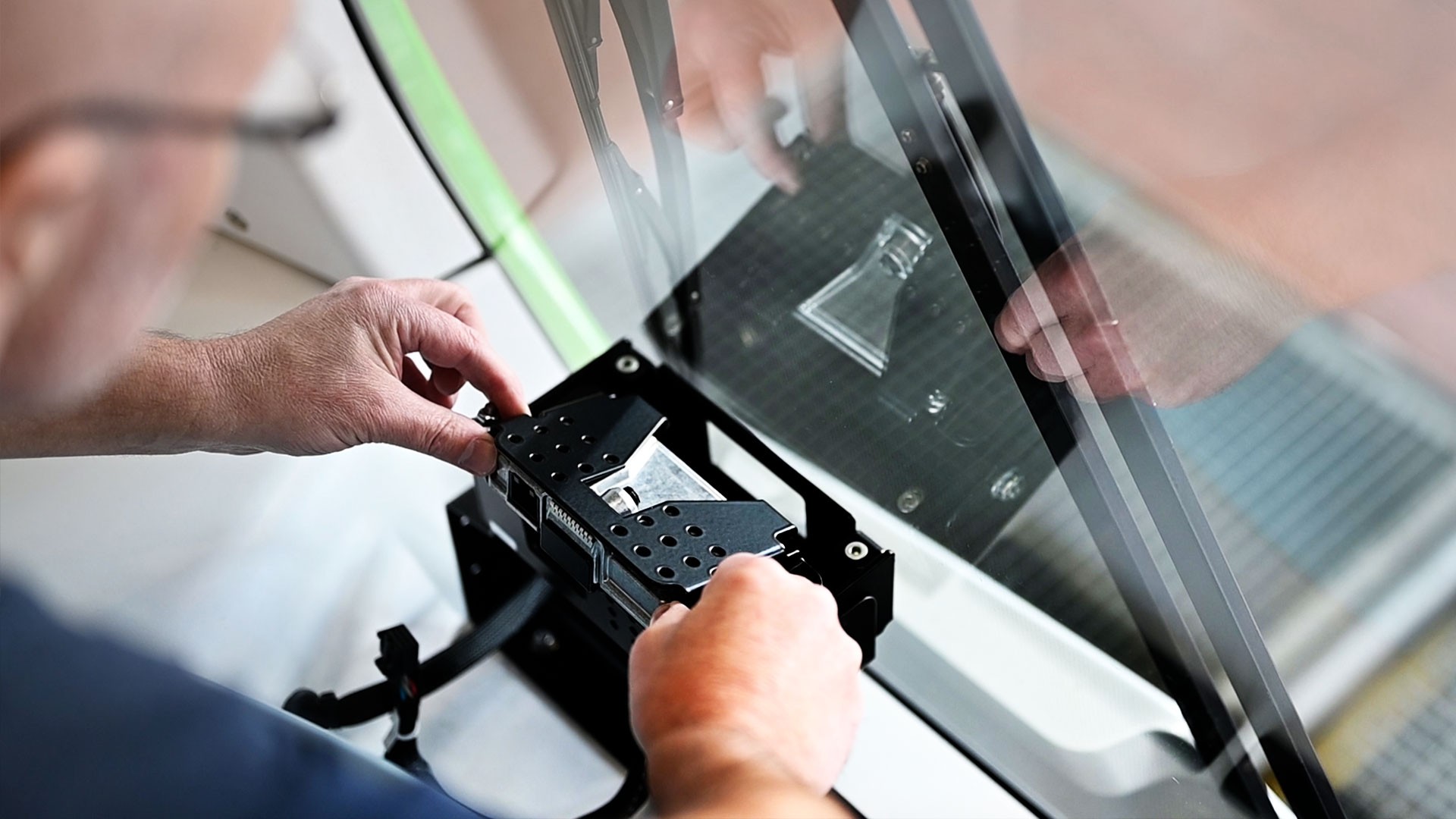 Technician assembling components in precision manufacturing process