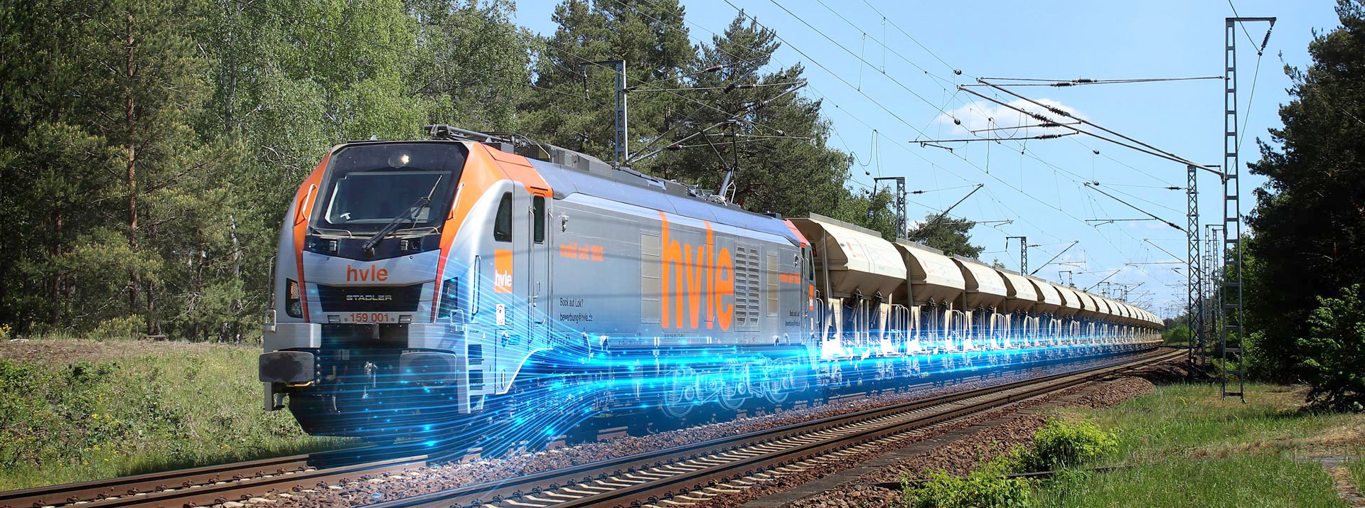 Electric train moving along railway tracks.