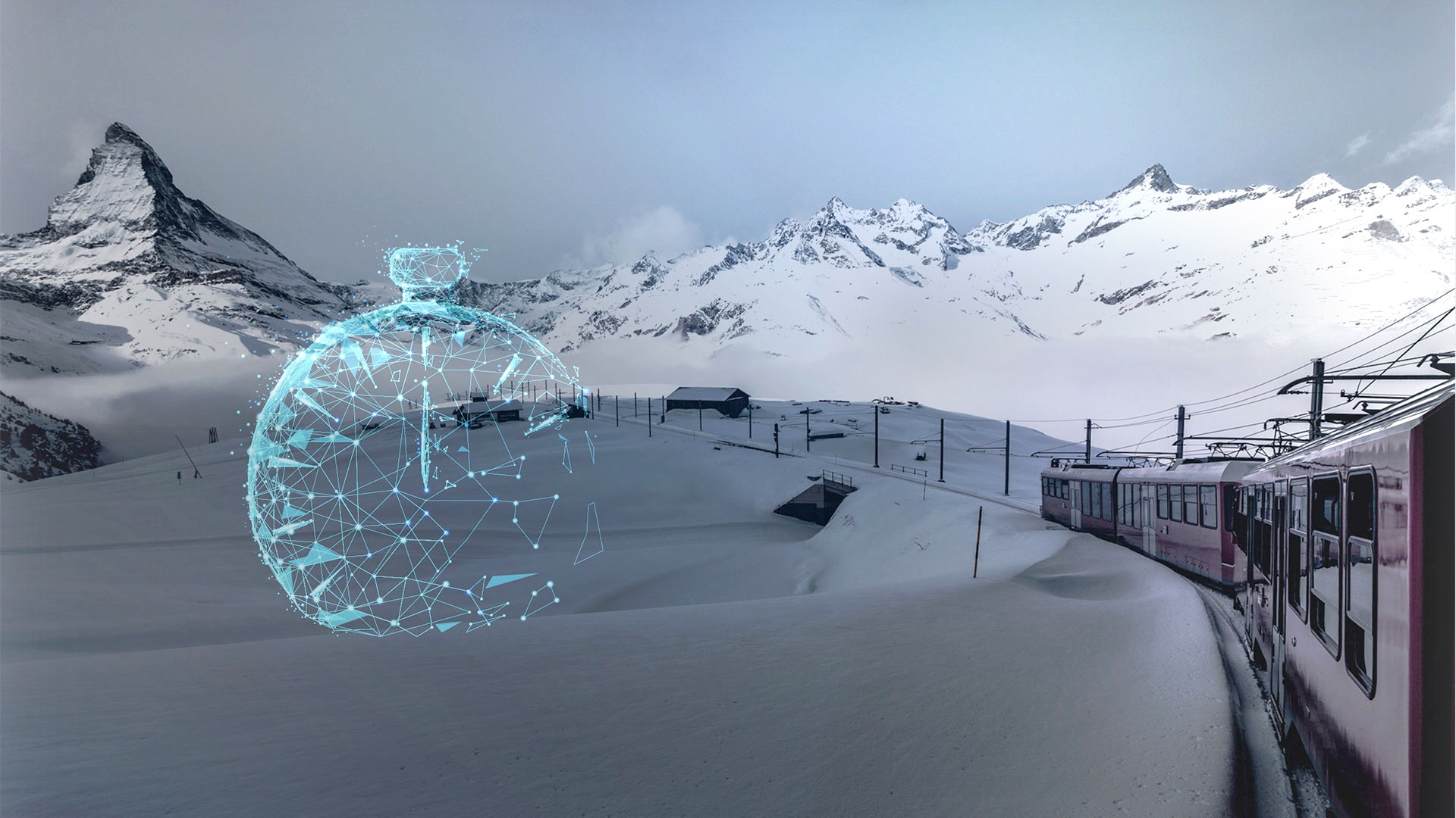 Train traveling through snowy mountain landscape with