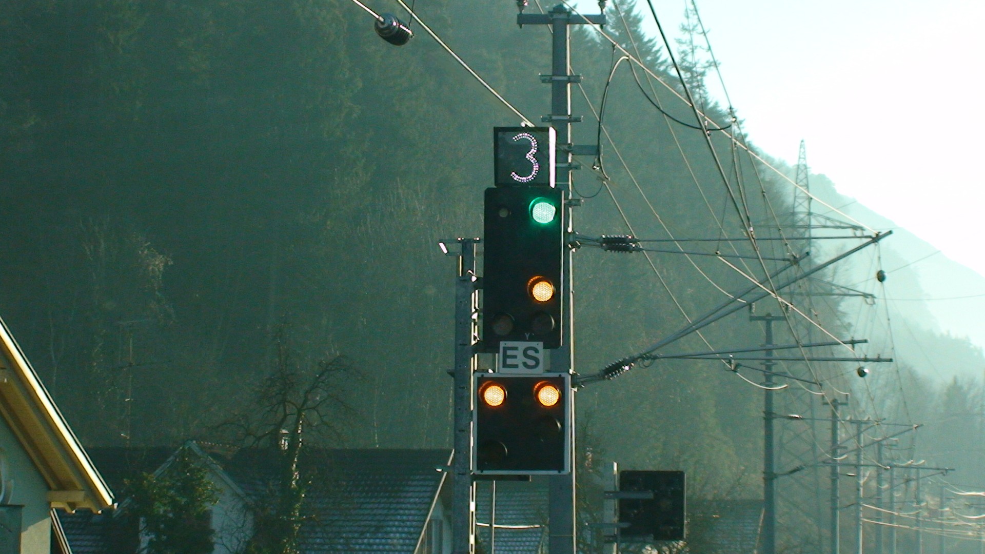 Traffic signal with green light and number