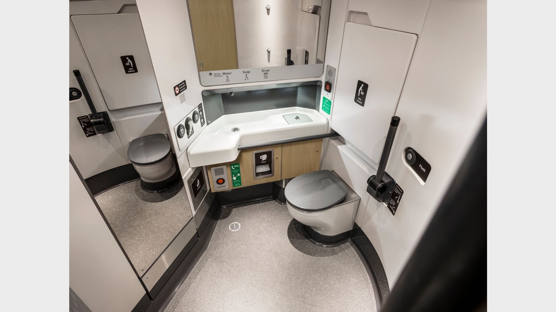In-train toilet cabin with wash basin, real photo