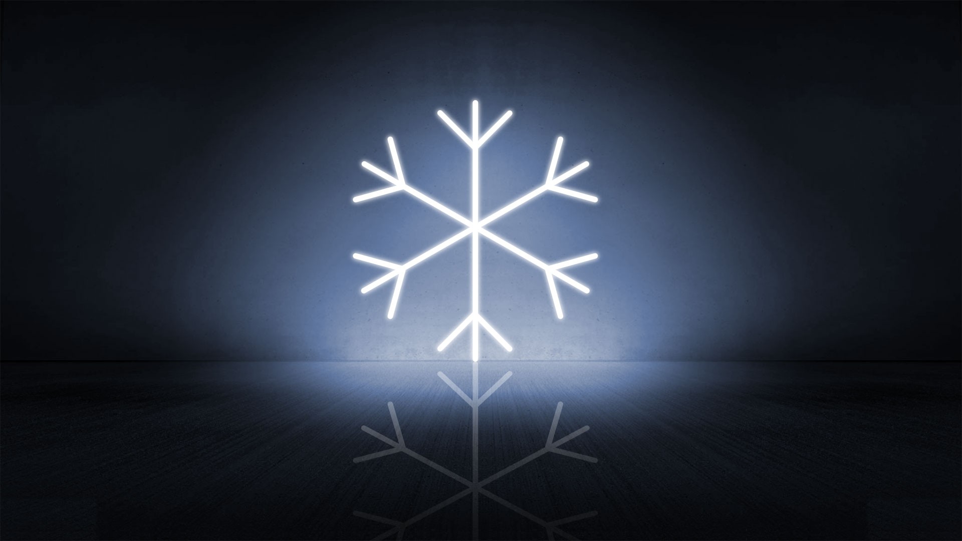 Neon snowflake symbol glowing on dark background