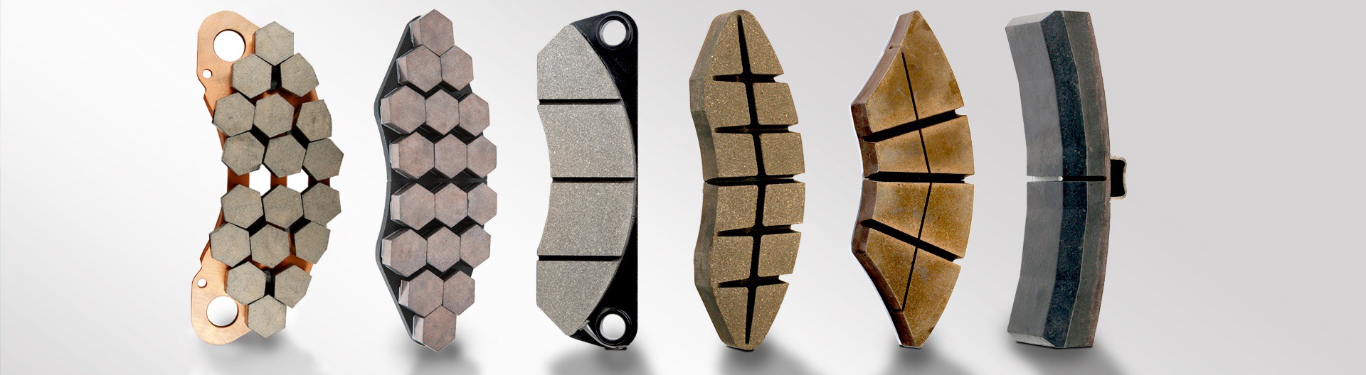 Various types of brake pads on display.