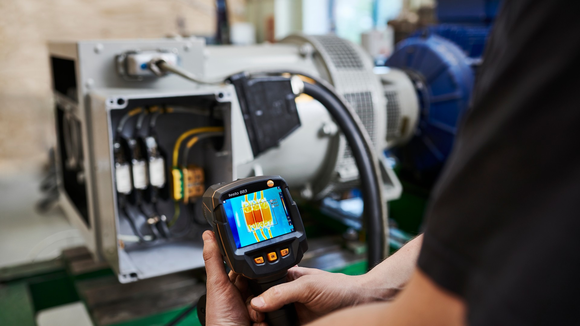 Thermal imaging device monitoring electrical equipment status.