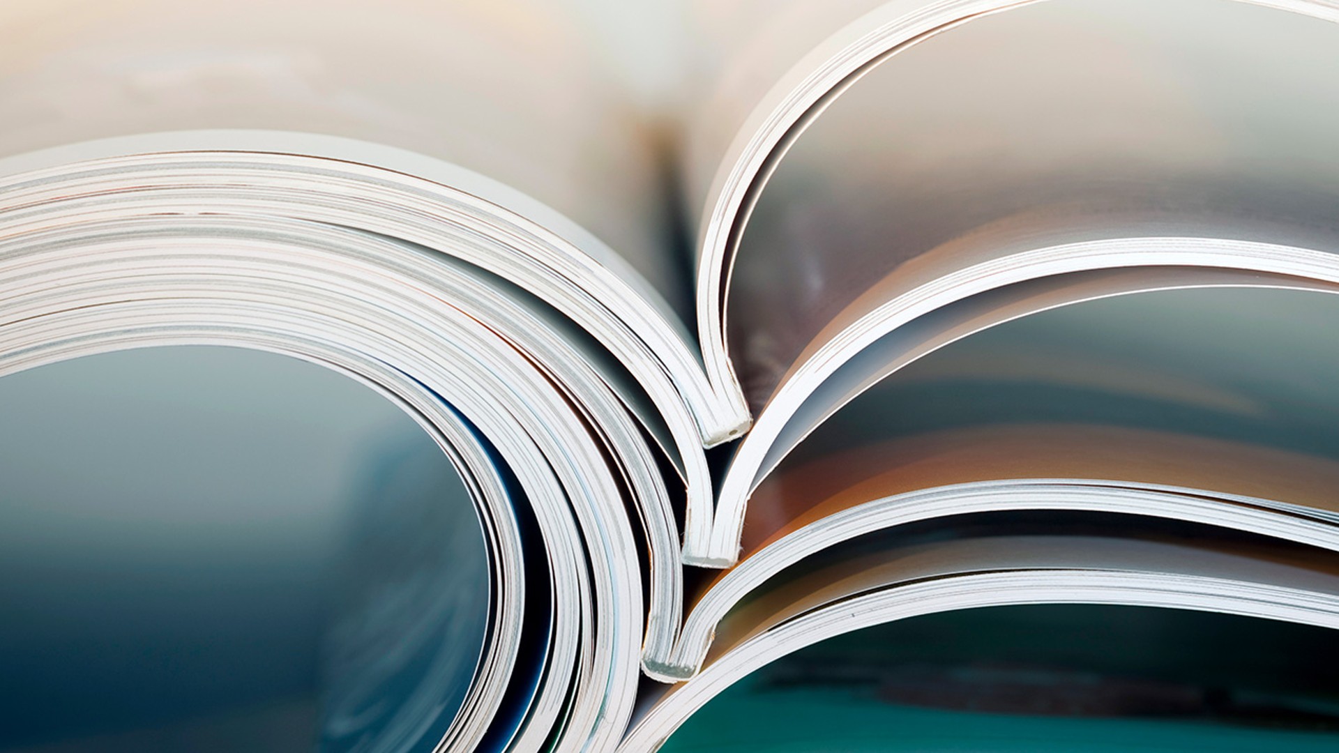 Open magazines with colorful pages displayed.