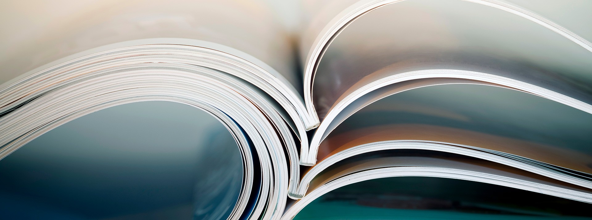 Open magazines with colorful pages displayed.