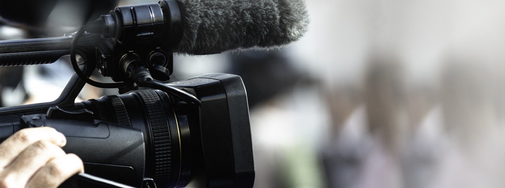 Camera and microphone capturing a live event.