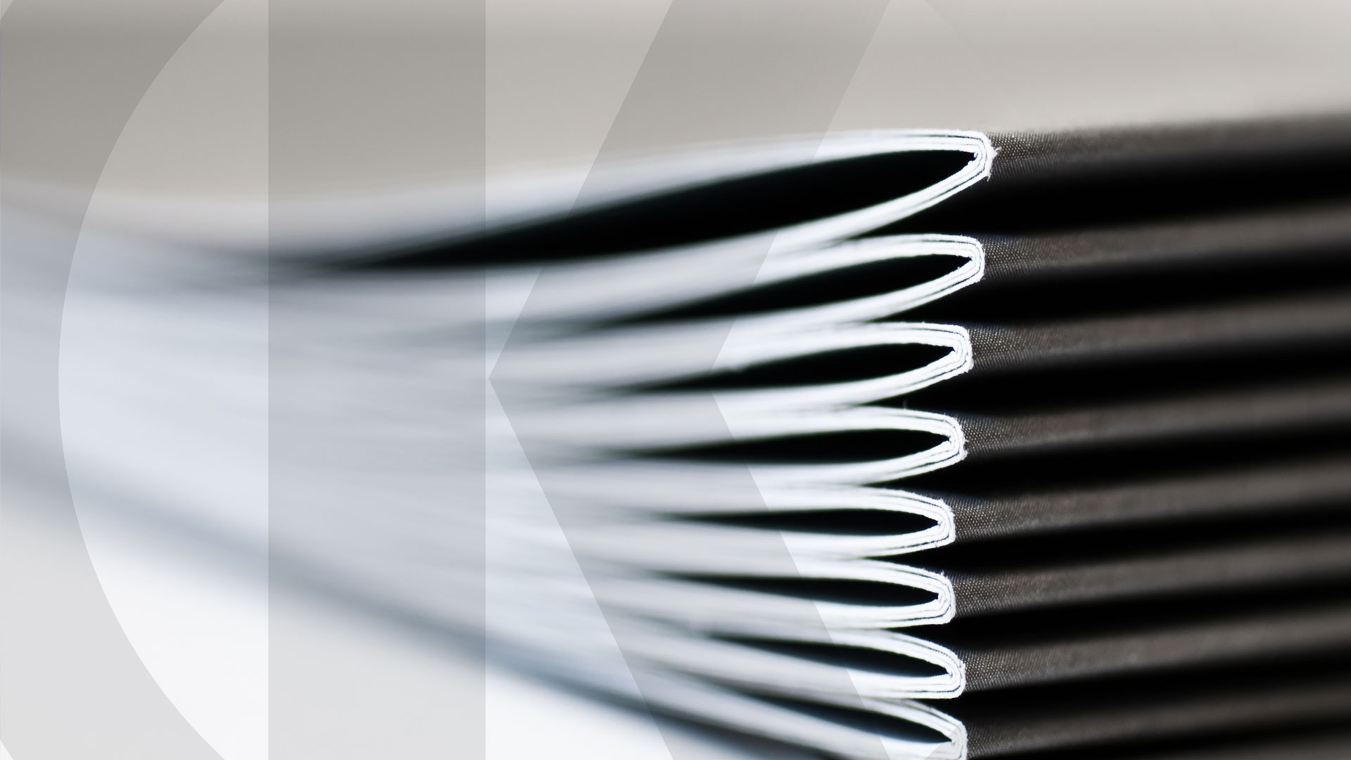Stack of neatly aligned black and white
