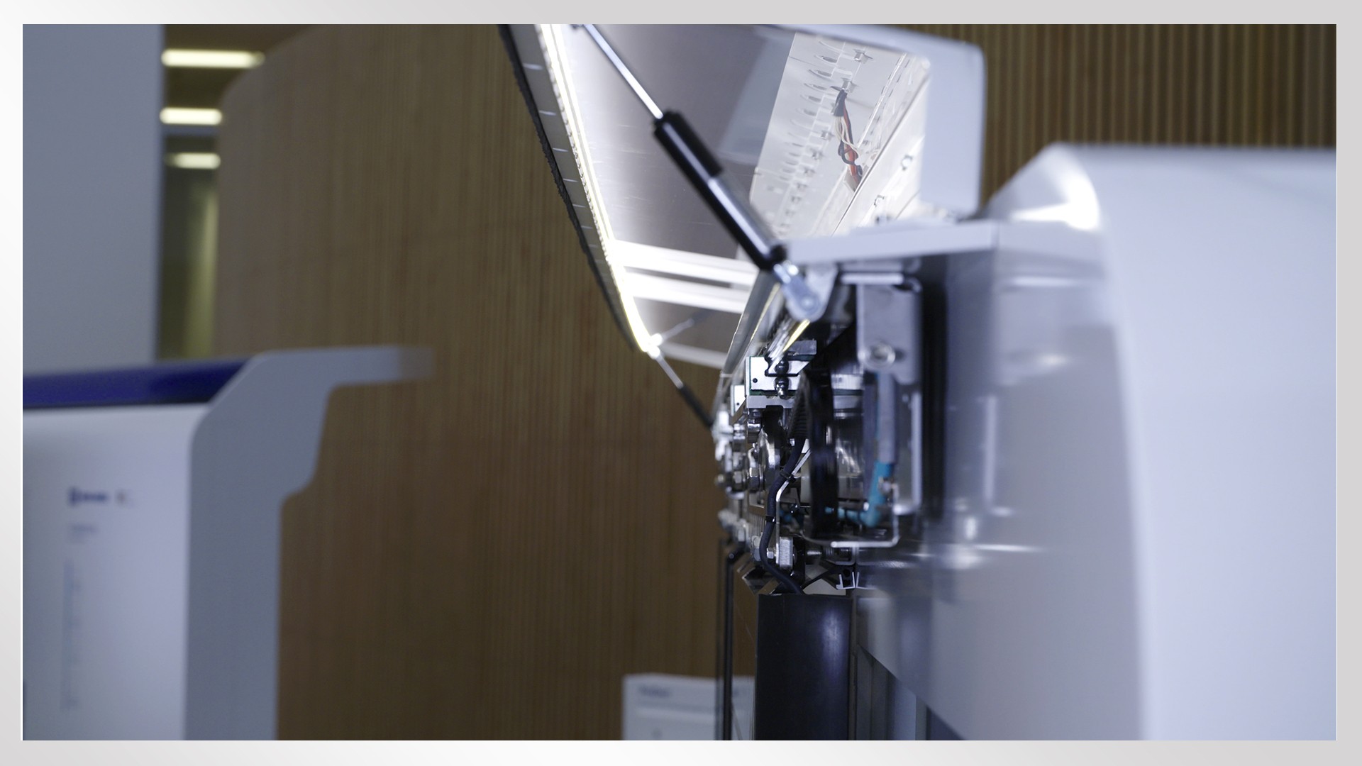 Manufacturing equipment with illuminated control panel.