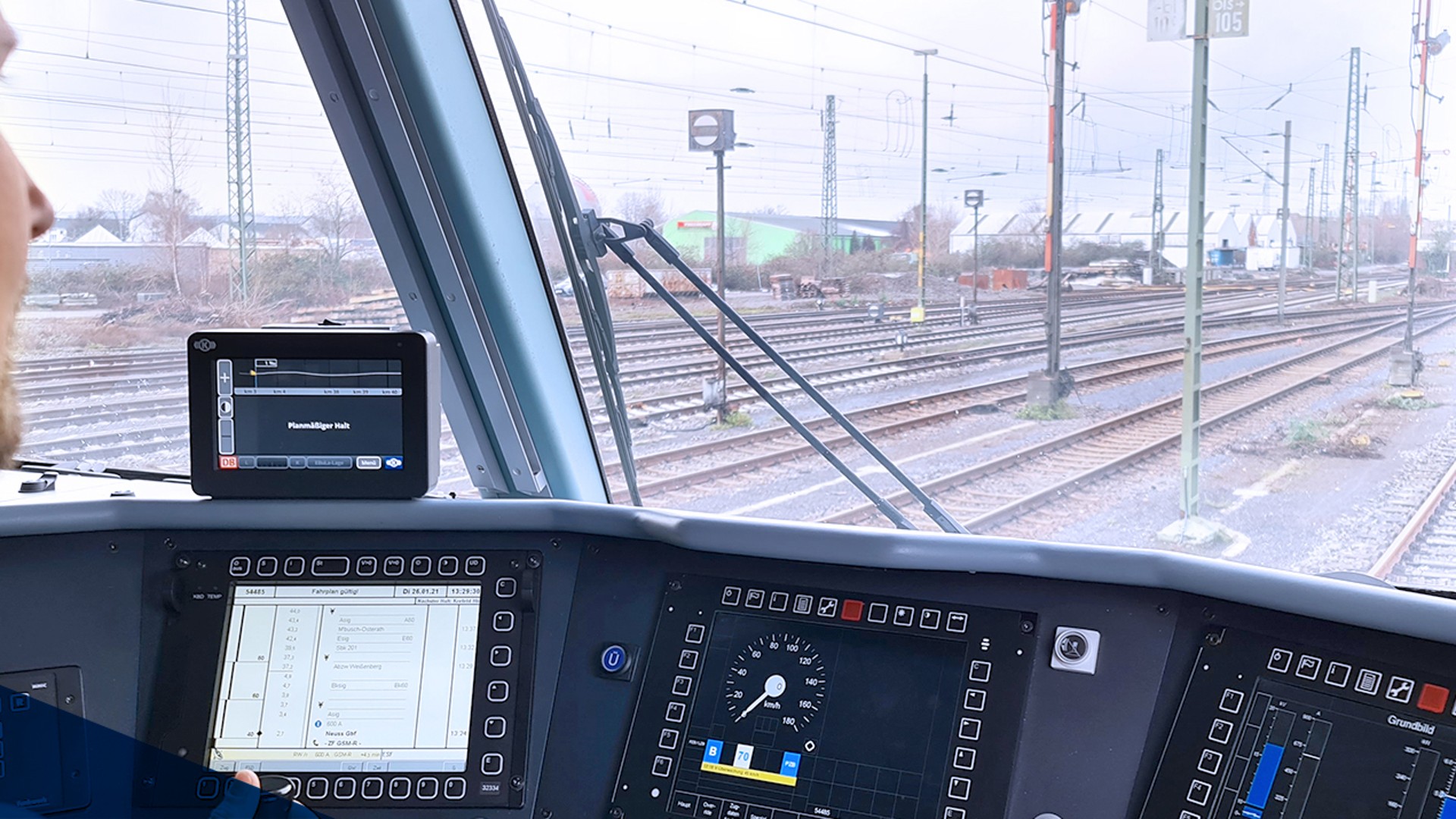Train driver's view from the cockpit controls.