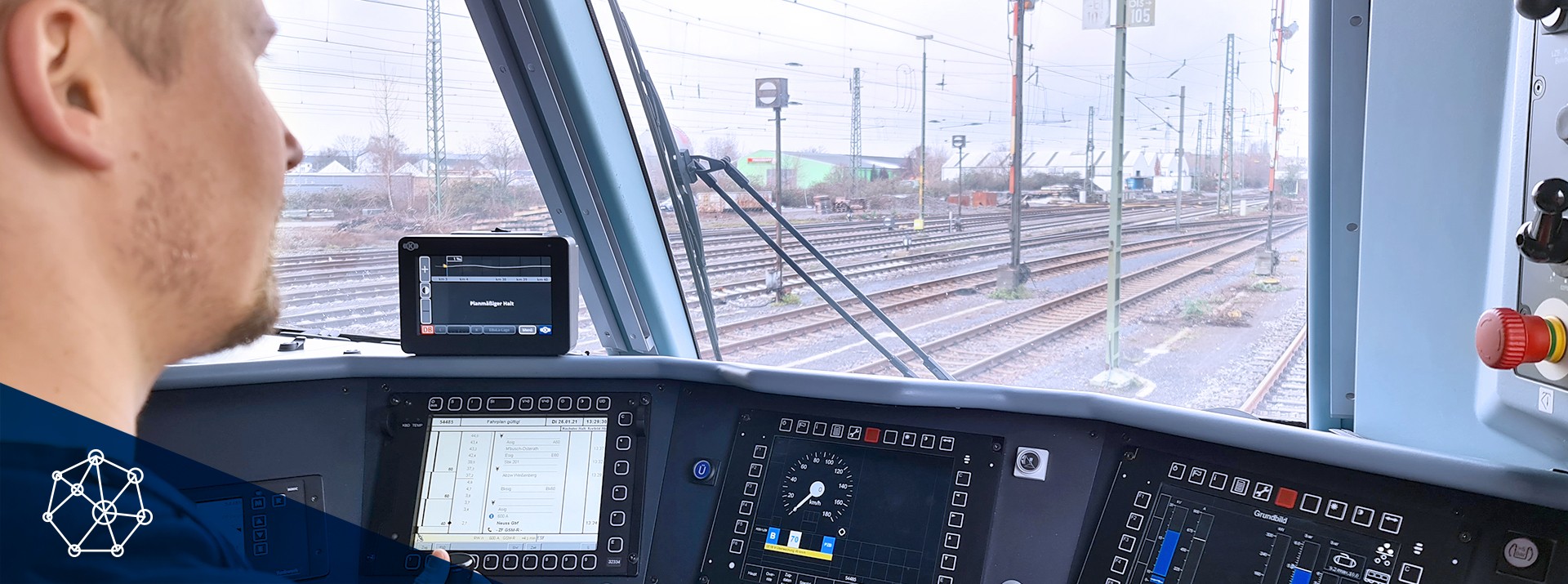 Train driver's view from the cockpit controls.