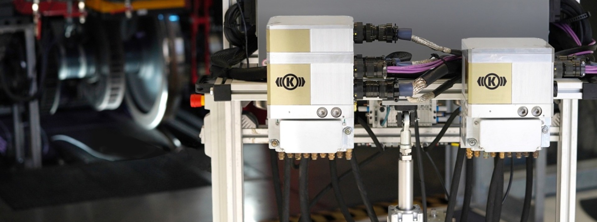 Industrial automation equipment with hydraulic connections.
