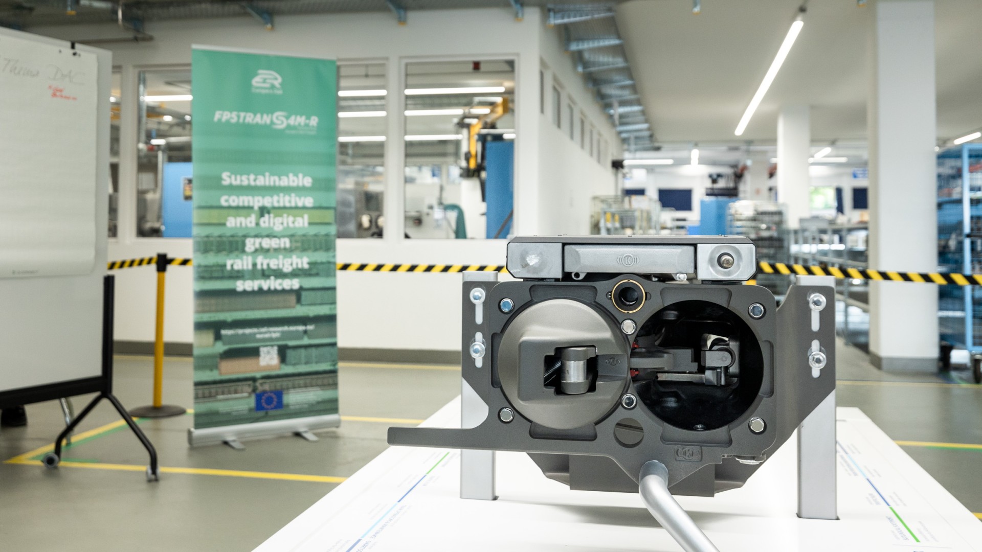 Rail freight technology display with informative banner.