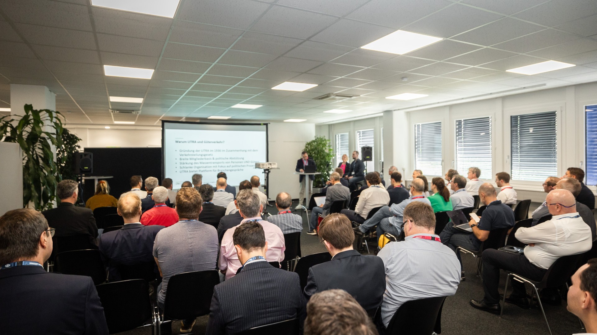 Conference presentation with audience in a meeting