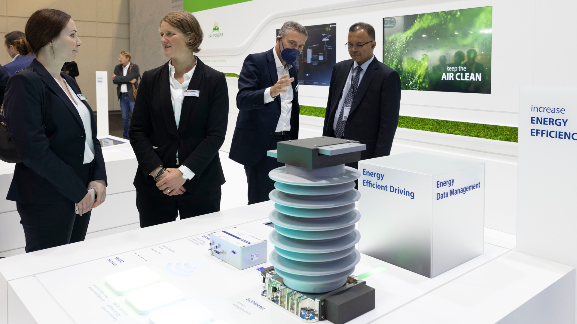 Business professionals discussing energy efficiency technologies.