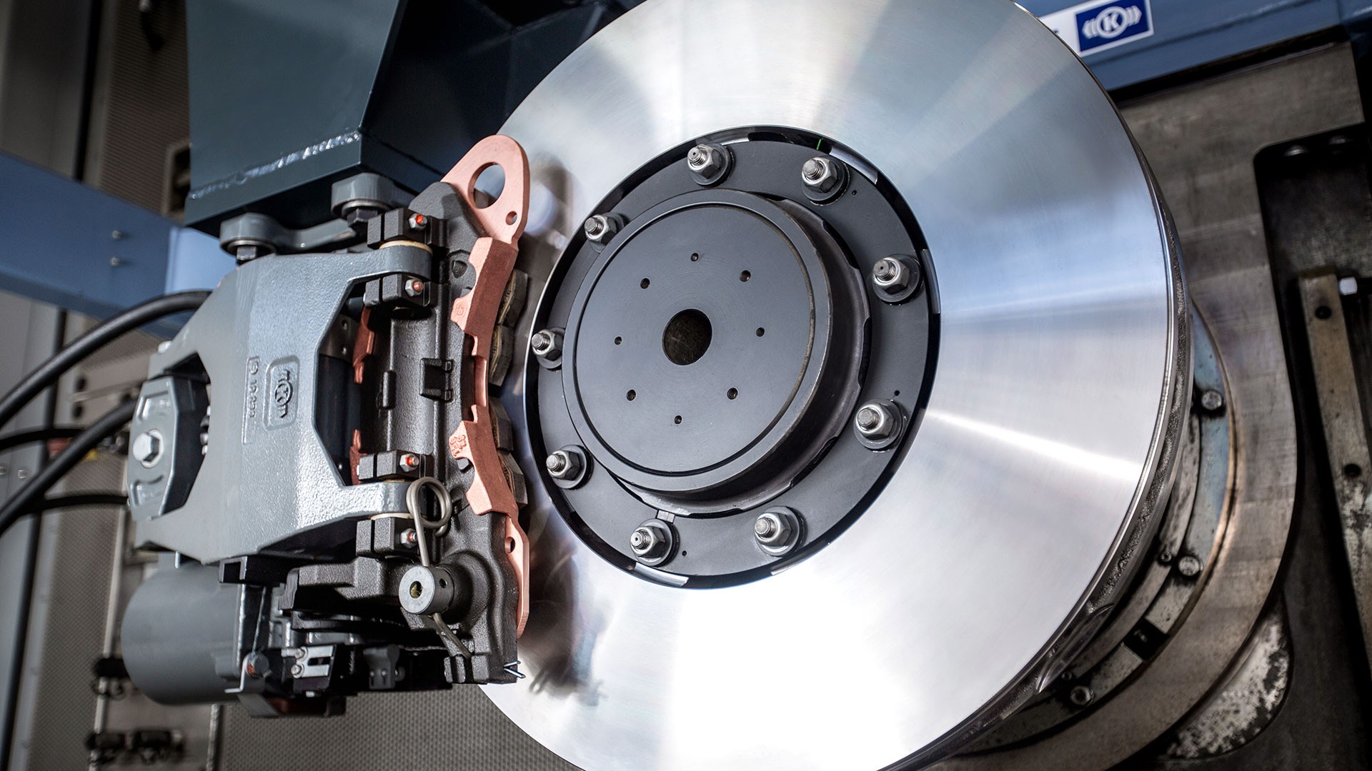 Brake caliper and rotor assembly in workshop