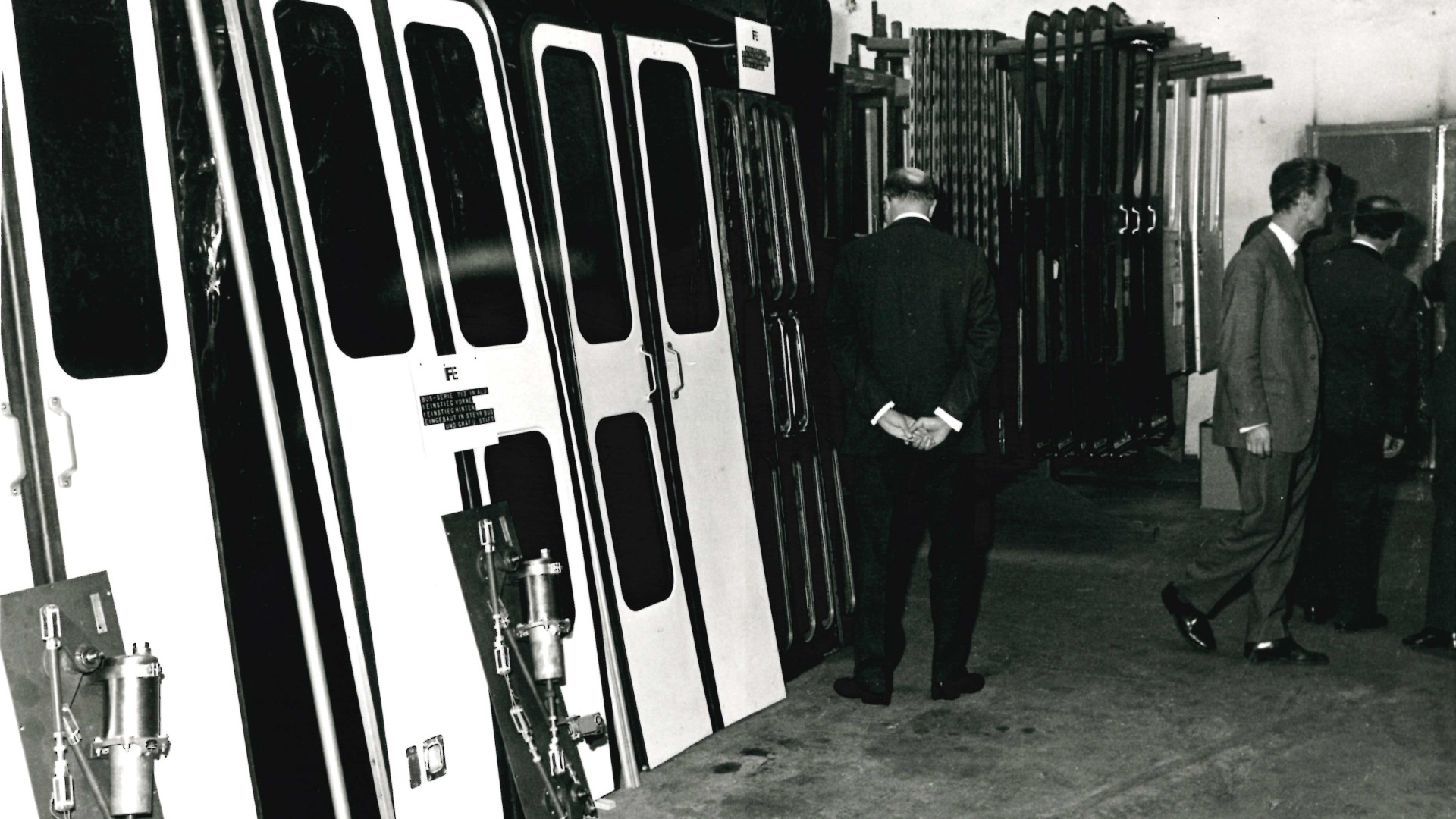 Industrial warehouse showcasing door components and machinery.