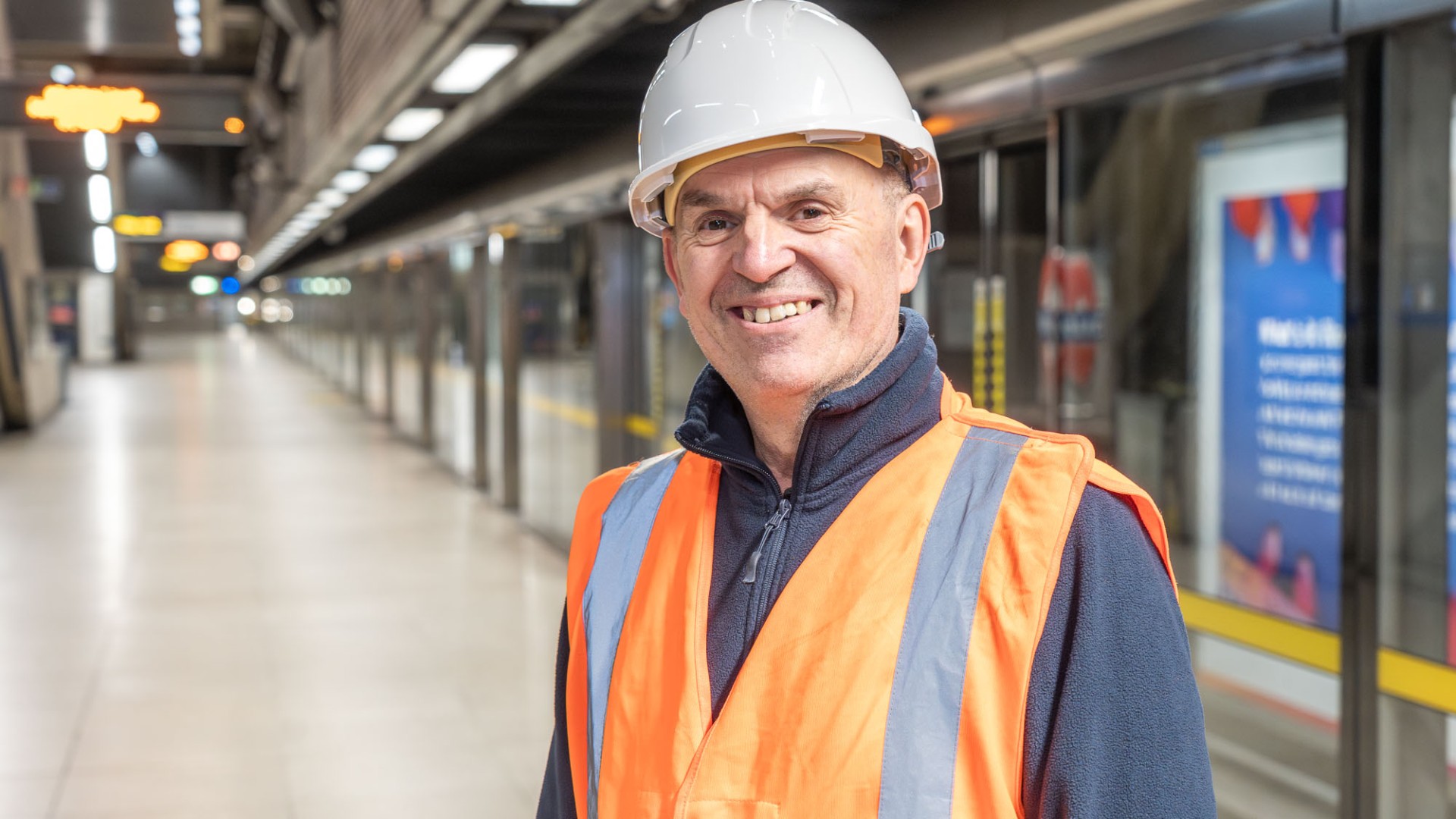 Nick Henley in front of platform screen doors at the london underground