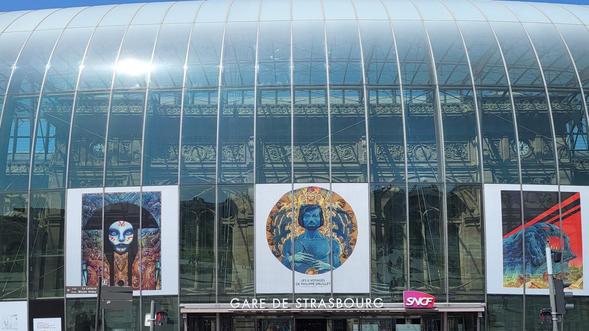Strasbourg train station with colorful art displays.