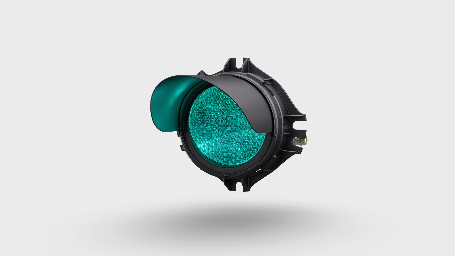 Green traffic signal light with protective visor.