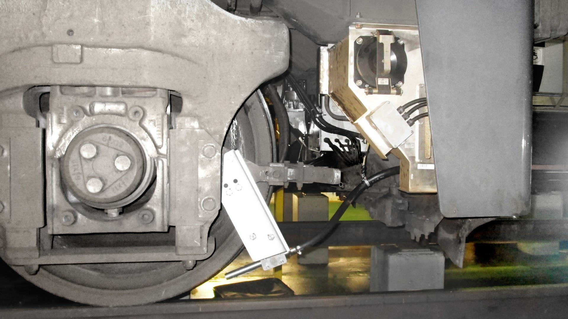 Train wheel assembly with braking system components.