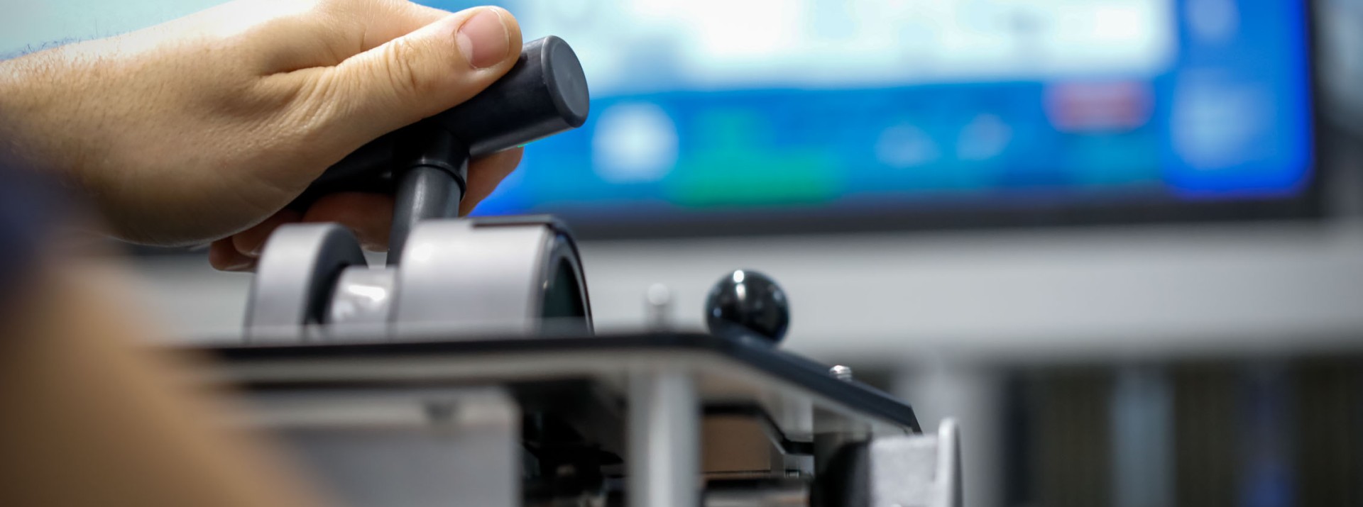 Hand operating control joystick with computer monitor