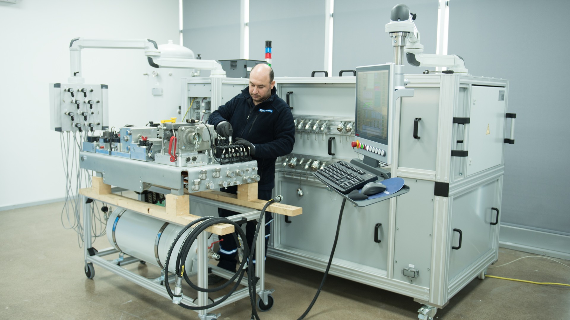 Technician working on machinery in technical lab