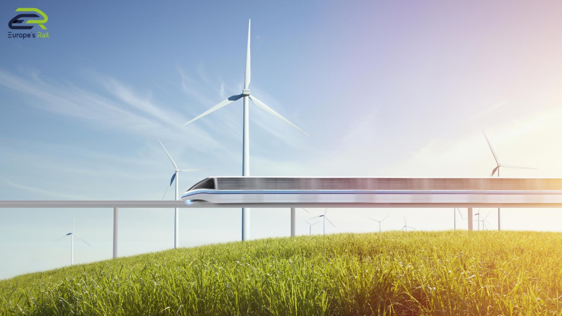 Futuristic train passing through wind turbines landscape.