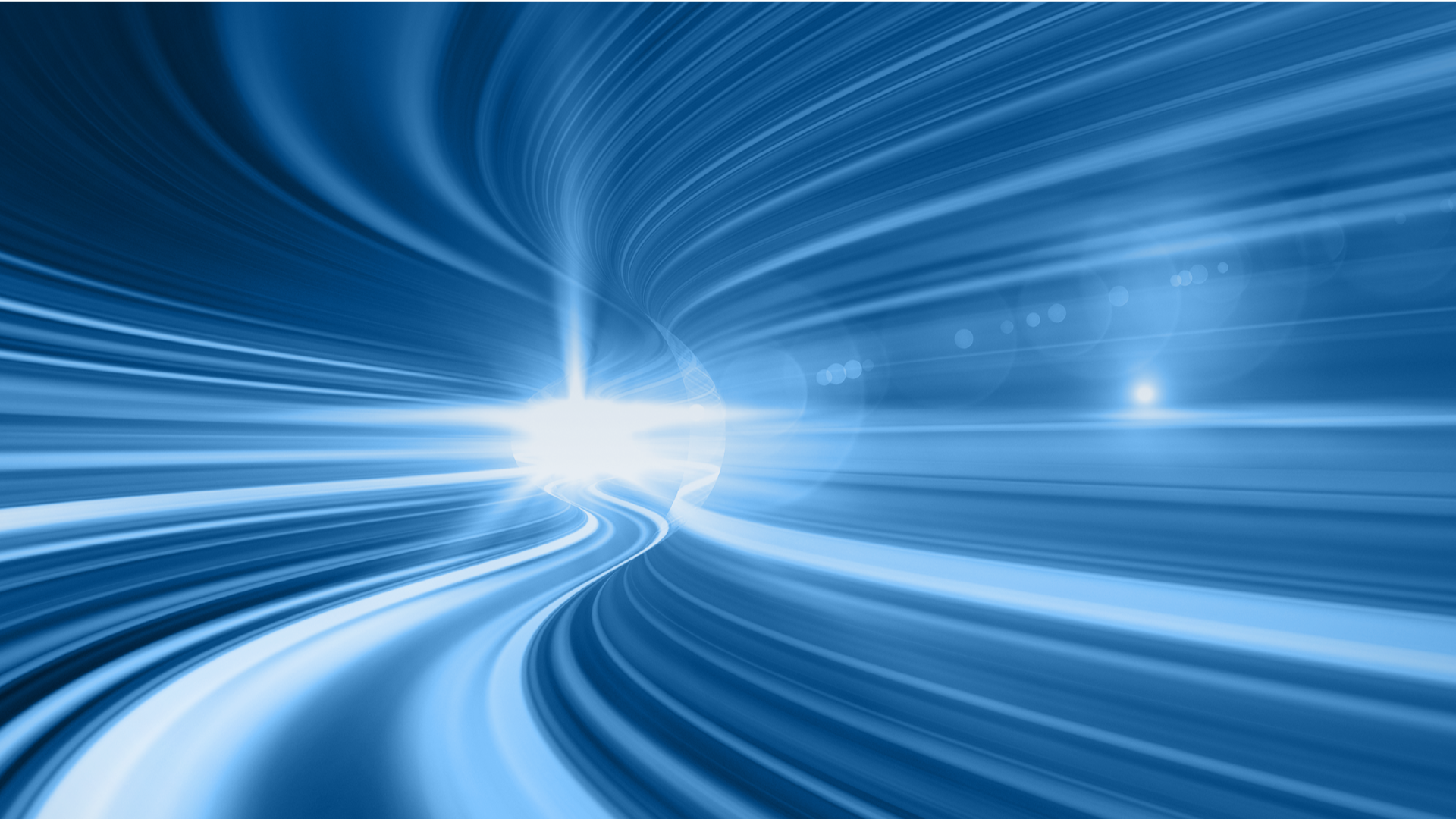 Abstract blue light trails on dark background