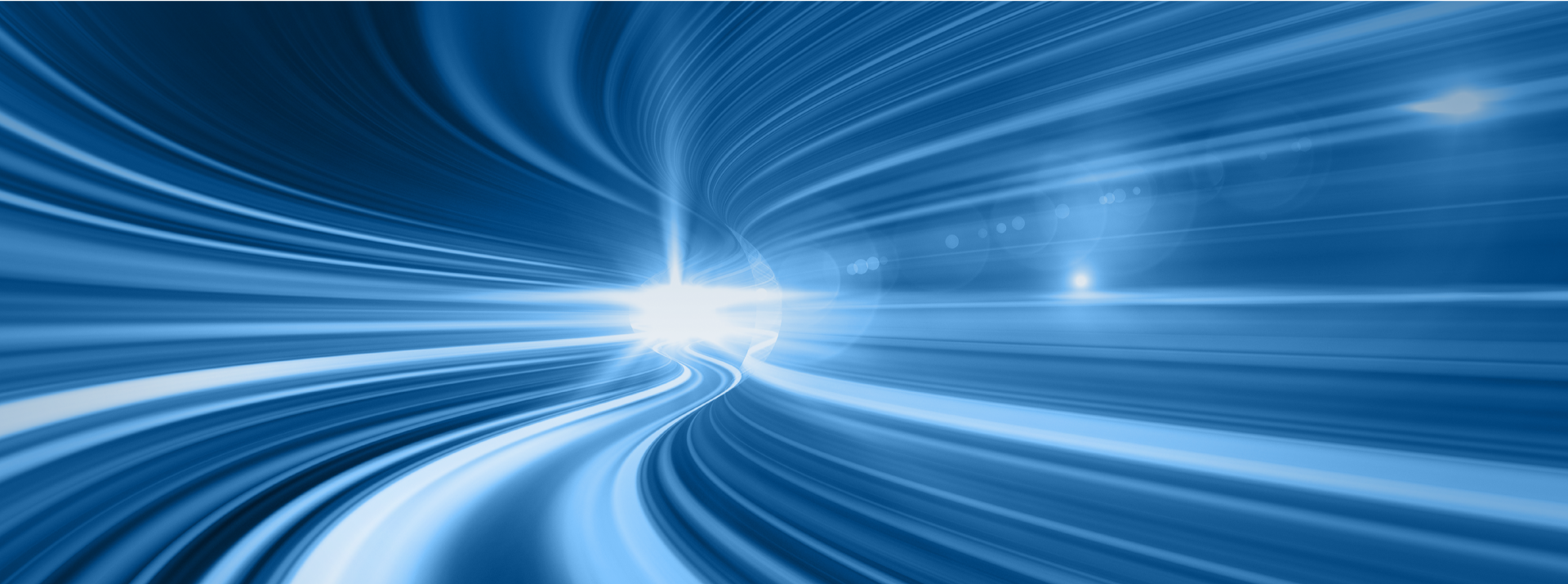 Abstract blue light trails on dark background