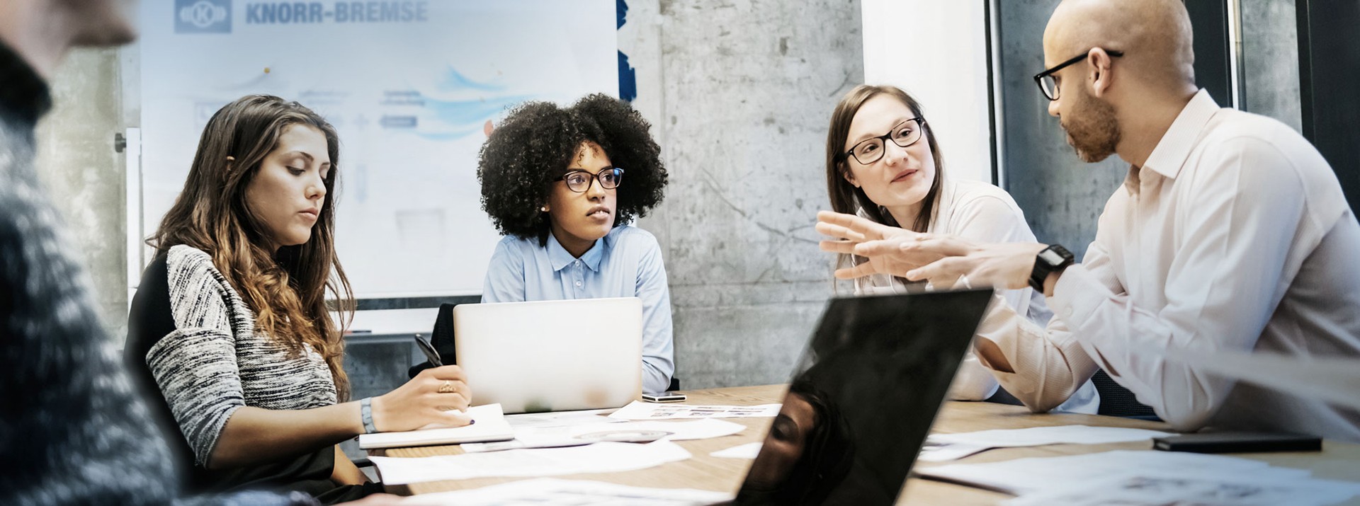 Diverse team collaborating in a modern office