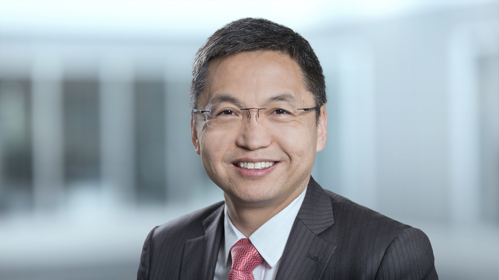 Smiling professional man in business attire.