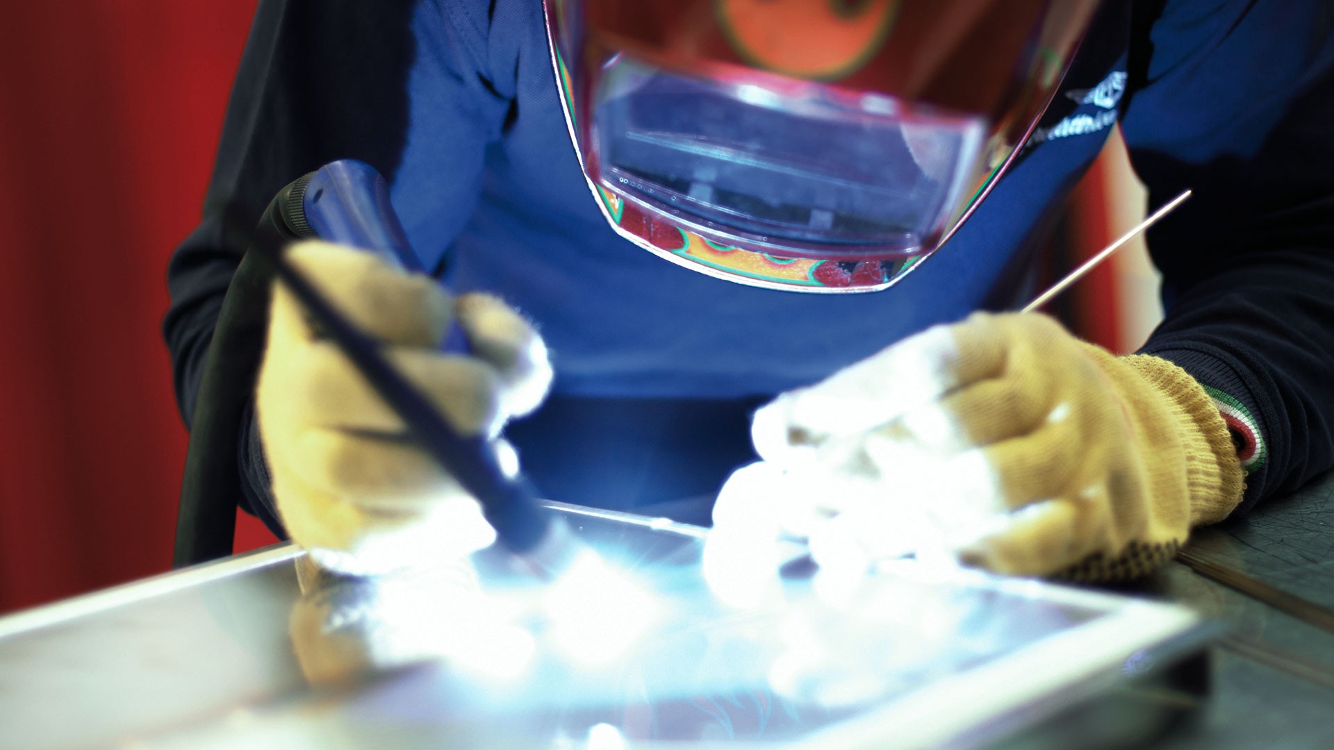 Welding process with protective gear and equipment.