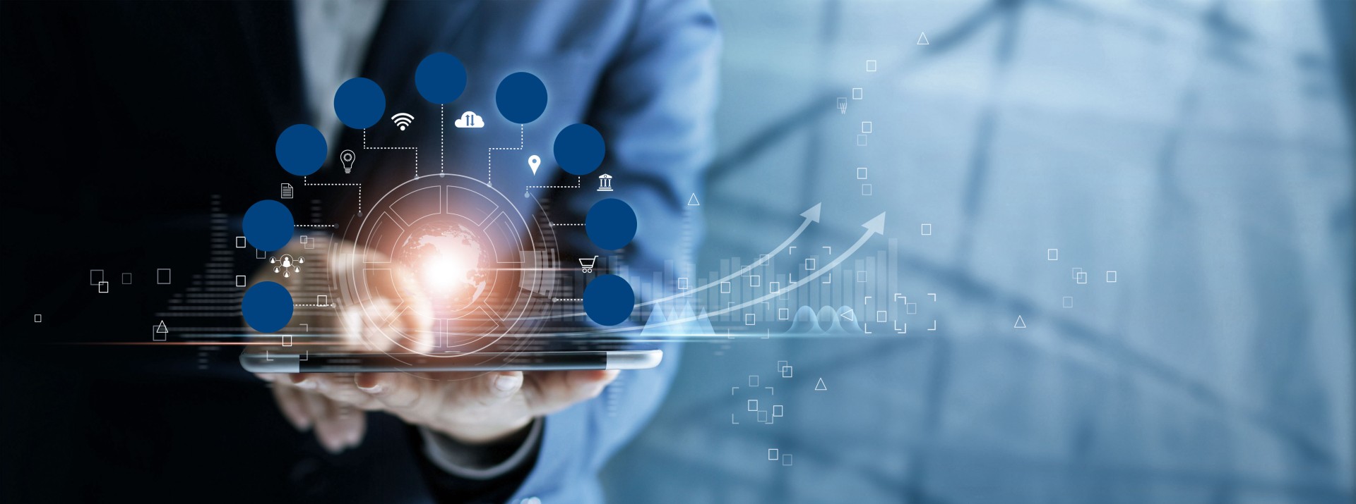 Businessman using tablet with digital data visuals.