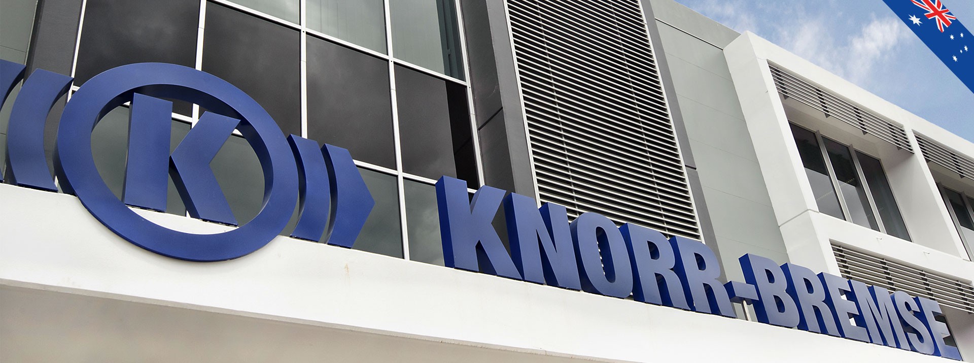 Knorr-Bremse company sign outside modern building.