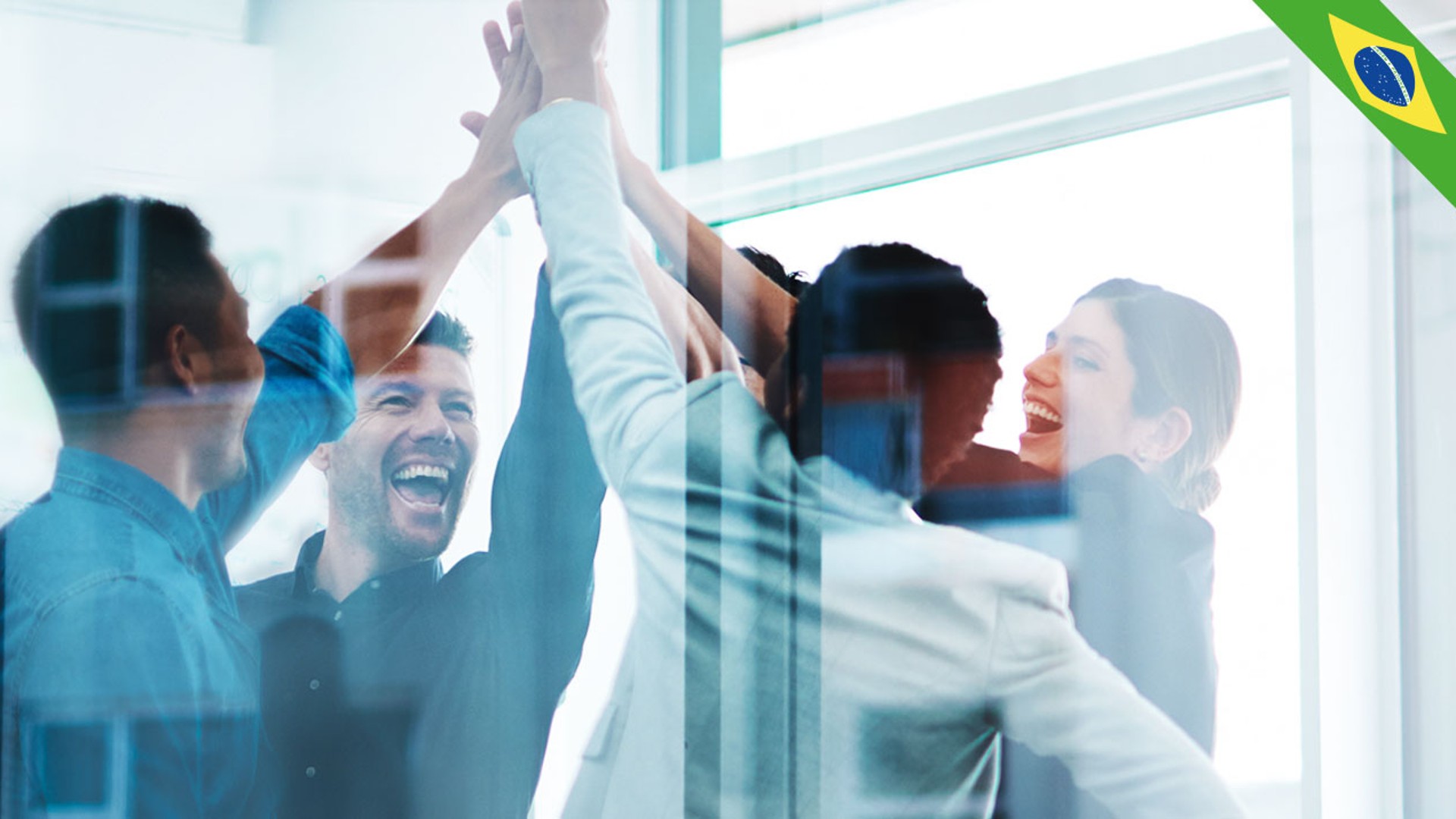 Team celebrating success with high-fives in office.